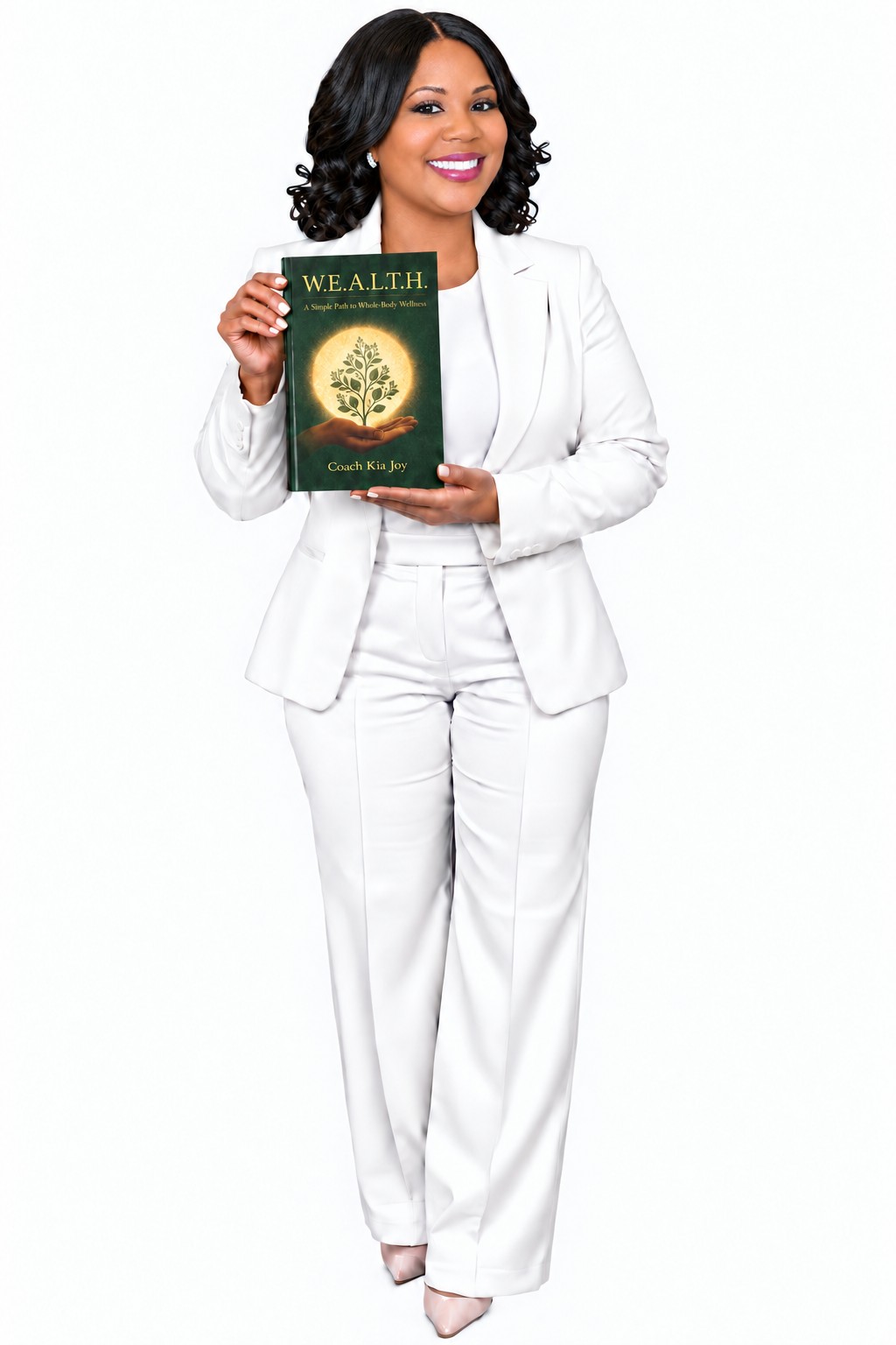 Coach Kia Joy holding her upcoming book, W.E.A.L.T.H.: A Simple Path to Whole-Body Wellness